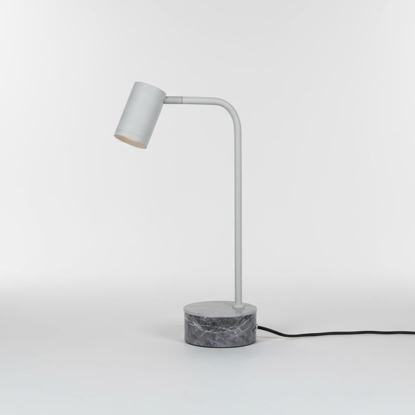 Modern table lamp with marble base on a white background